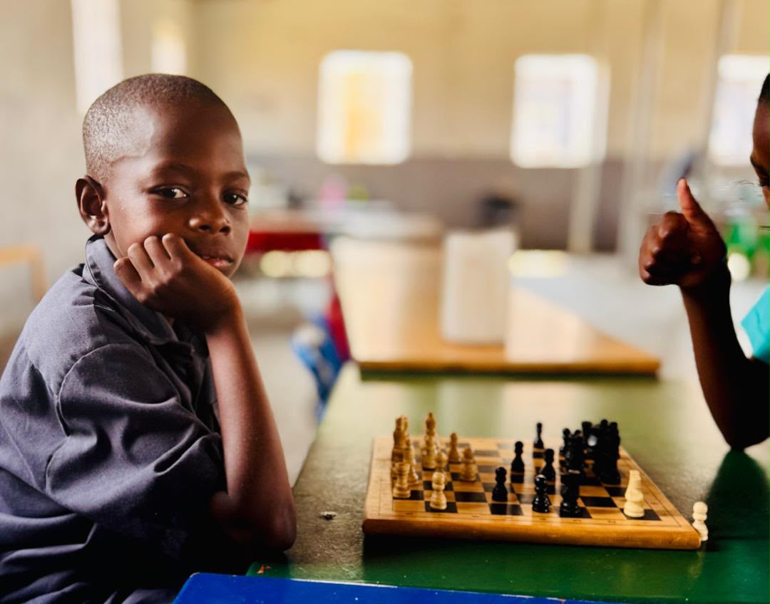 Pupil at the chess board