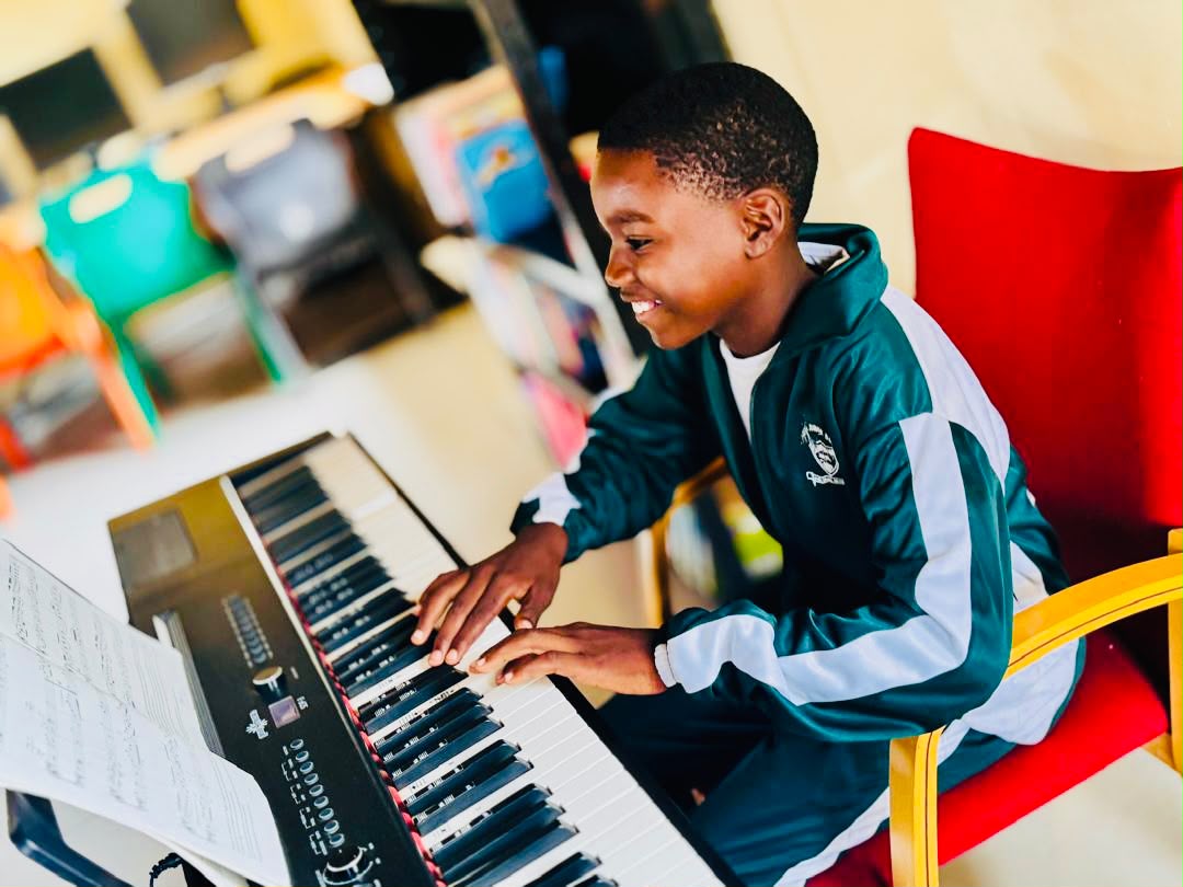 Pupil playing the keyboard