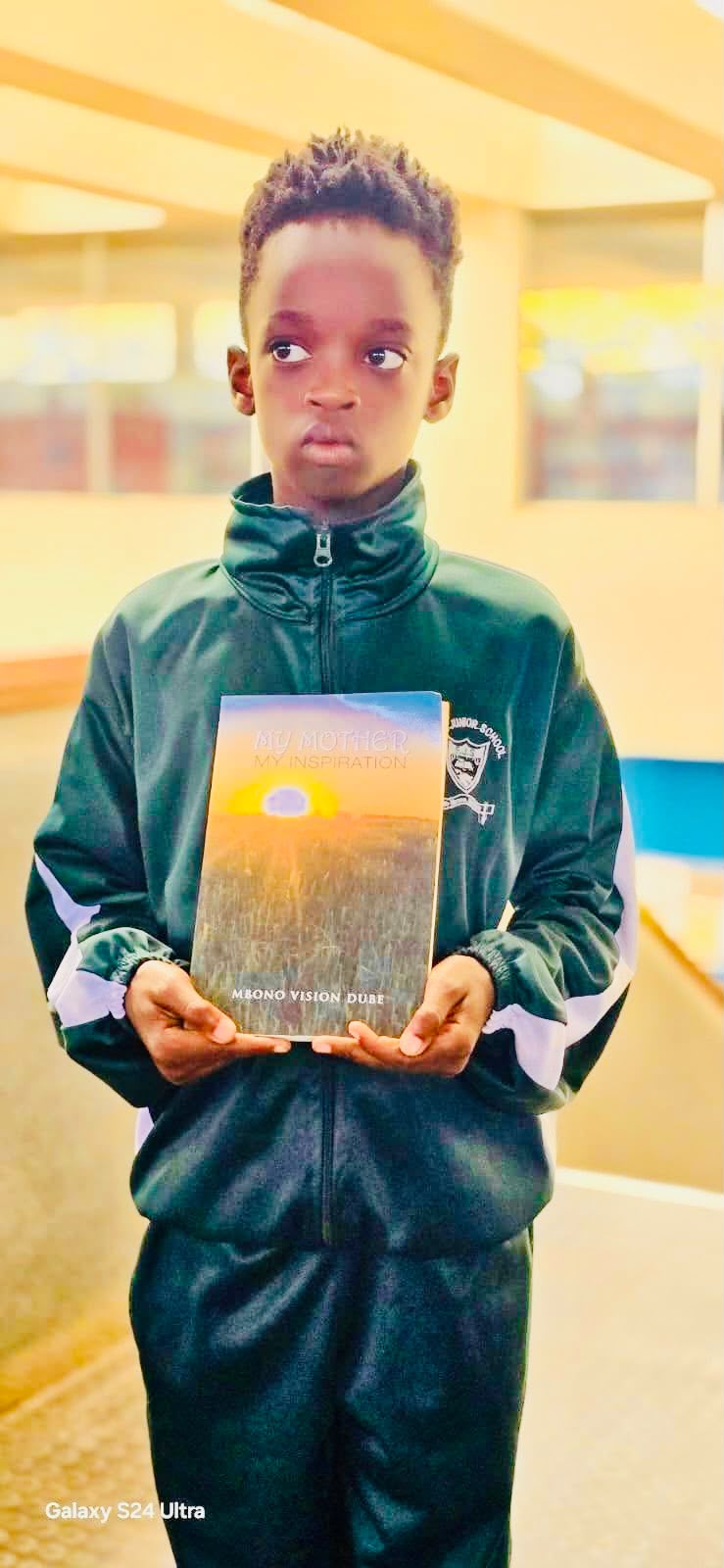 Pupil holding the book My Mother, My Inspiration