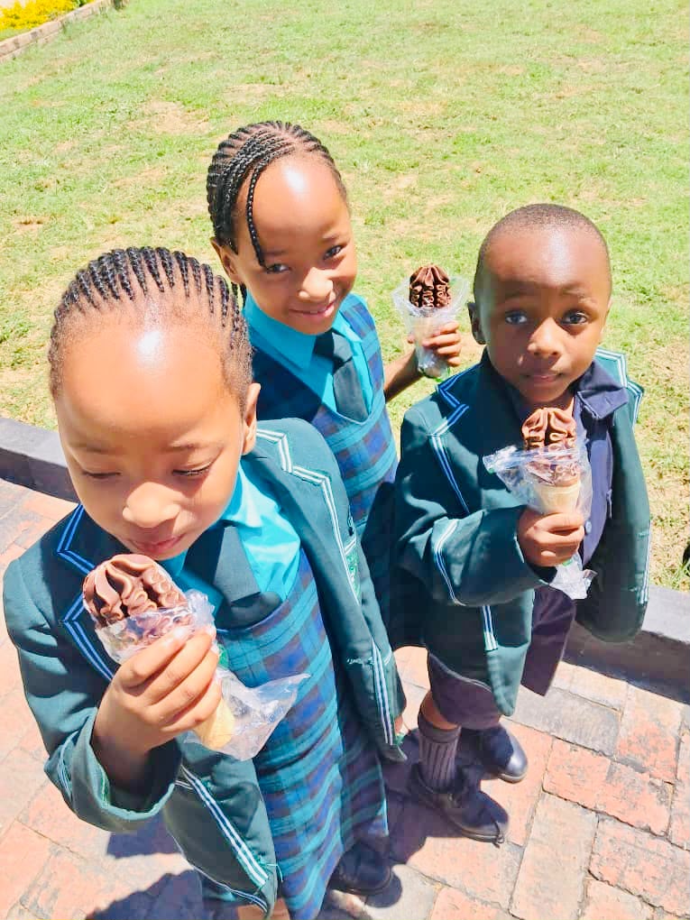 Three pupils enjoying ice creams