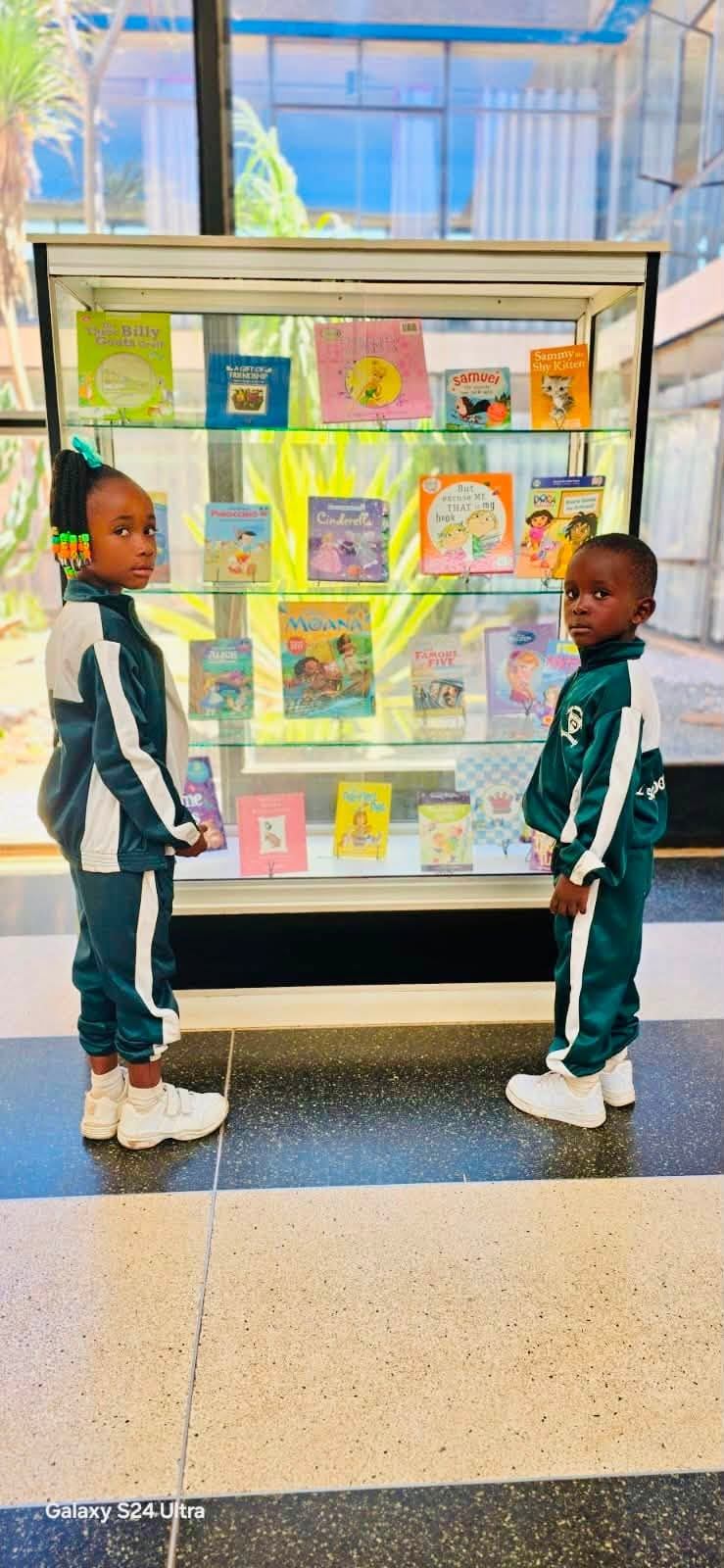 Two young pupils at the library book display